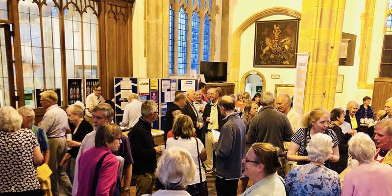 People chatting in the Parish Church